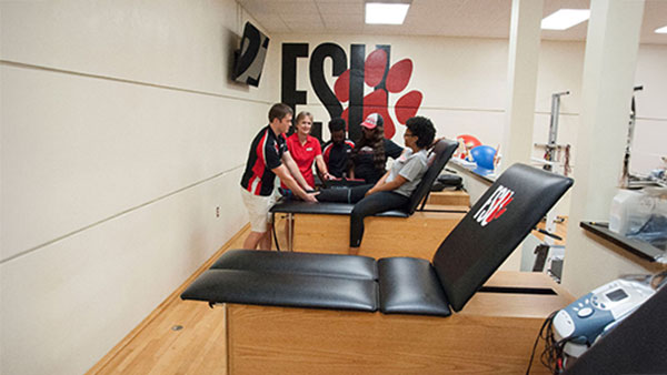 student athletes in training room